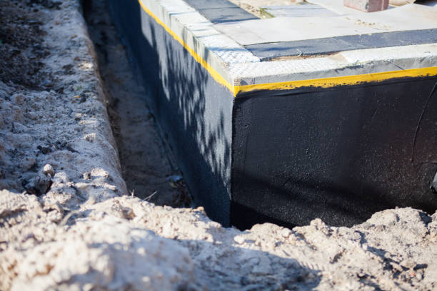 Professional Interior Drainage System technician working in Mumford, NY